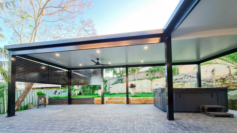 L-shaped insulated patio encompassing a luxurious spa.