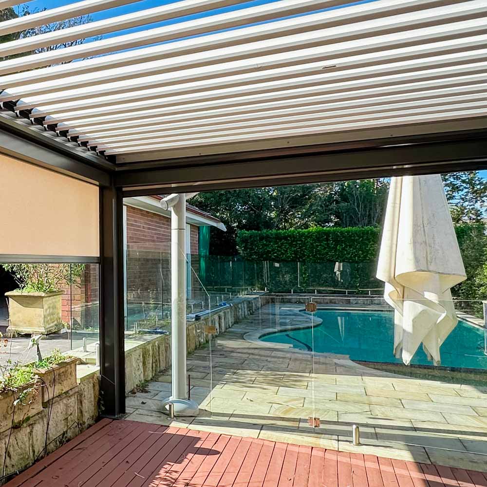 Modern outdoor space with louvred roof and Zipscreen blinds, providing climate control and elegance by Sydney Patios